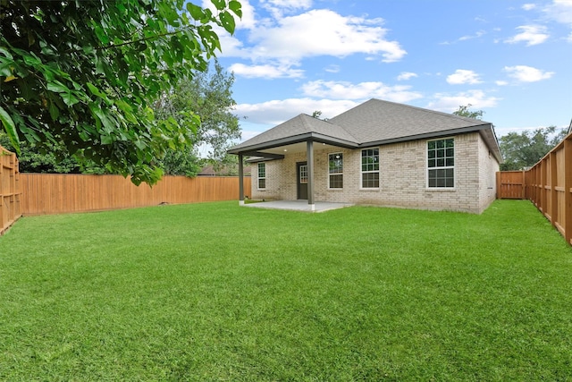 5118 Danfield Dr, Houston, TX 77053 - rear view of house with brick siding, a patio area, a fenced backyard, and a shingled roof