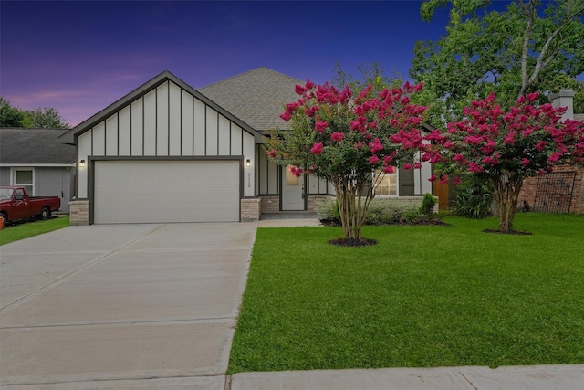 5118 Danfield Dr, Houston, TX 77053 - view of front of home featuring board and batten siding, an attached garage, roof with shingles, driveway, and a lawn