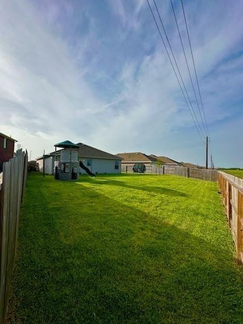 4206 Barrington Cove Ln, Baytown, TX 77521 - fenced backyard featuring a playground