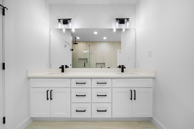 1305 Amundsen St N, Houston, TX 77009 - bathroom with a shower stall, double vanity, and recessed lighting