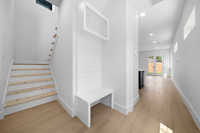 1305 Amundsen St N, Houston, TX 77009 - staircase featuring wood finished floors and recessed lighting