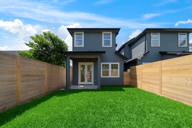1305 Amundsen St N, Houston, TX 77009 - rear view of property with french doors, a fenced backyard, and a ceiling fan