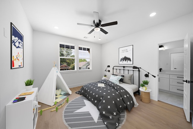 1305 Amundsen St N, Houston, TX 77009 - bedroom featuring light wood-type flooring, recessed lighting, connected bathroom, and ceiling fan