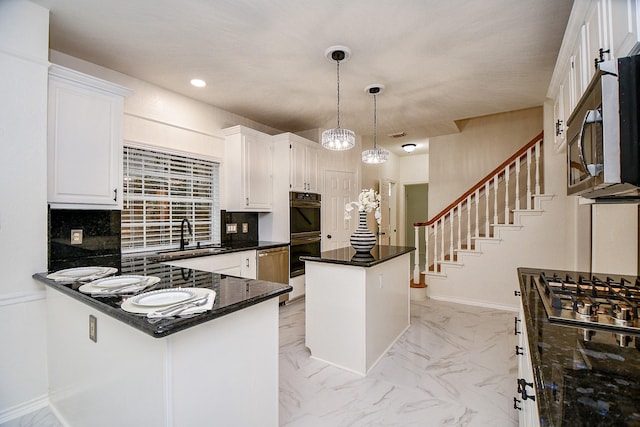 7014 Greatwood Trails Ct, Sugar Land, TX 77479 - kitchen with appliances with stainless steel finishes, white cabinets, light marble finish flooring, a center island, and recessed lighting