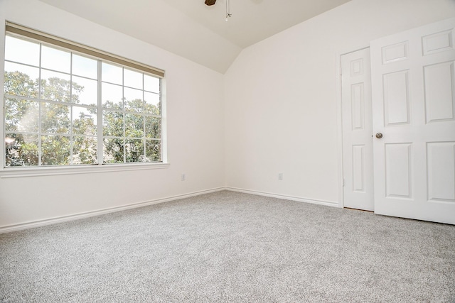 7014 Greatwood Trails Ct, Sugar Land, TX 77479 - unfurnished bedroom featuring vaulted ceiling, carpet, and a ceiling fan