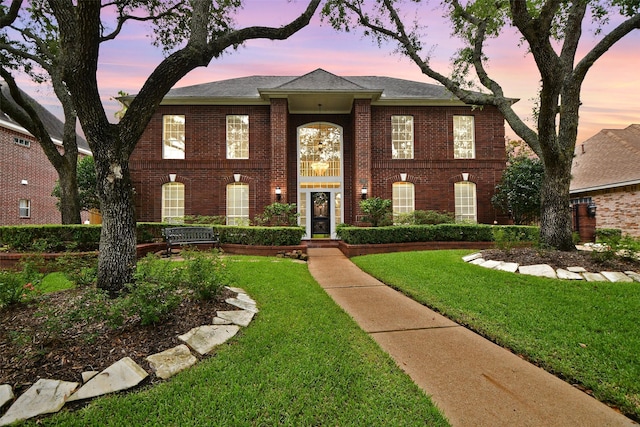 7014 Greatwood Trails Ct, Sugar Land, TX 77479 - colonial home with brick siding and a front yard