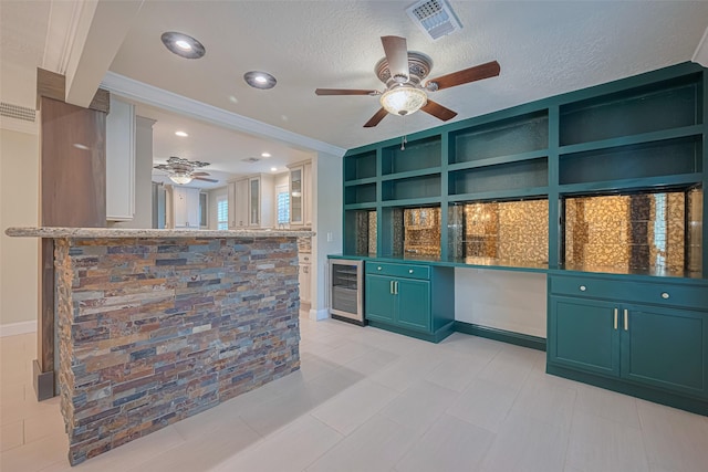 11710 Hillcroft St, Houston, TX 77035 - interior space with beverage cooler, a ceiling fan, open shelves, green cabinets, and crown molding