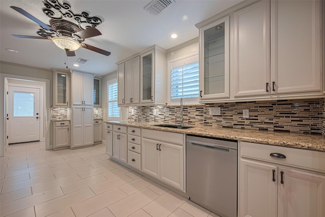 11710 Hillcroft St, Houston, TX 77035 - kitchen with stainless steel dishwasher, ceiling fan, backsplash, glass insert cabinets, and recessed lighting