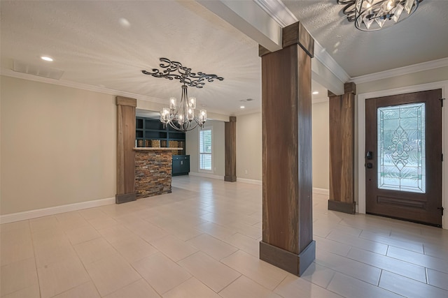 11710 Hillcroft St, Houston, TX 77035 - foyer featuring a chandelier, crown molding, ornate columns, light tile patterned floors, and recessed lighting