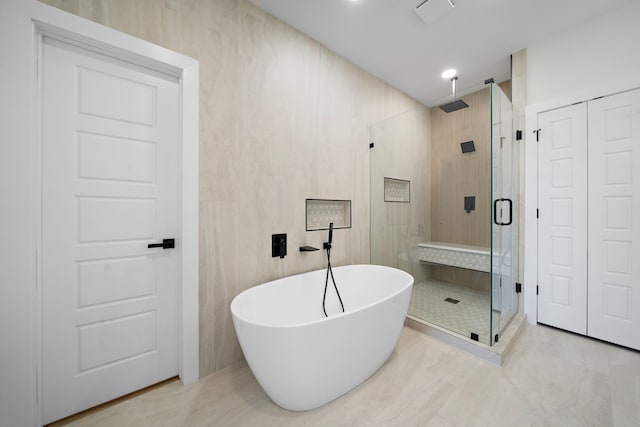 1307 Amundsen St N, Houston, TX 77009 - bathroom with a shower stall and a freestanding bath
