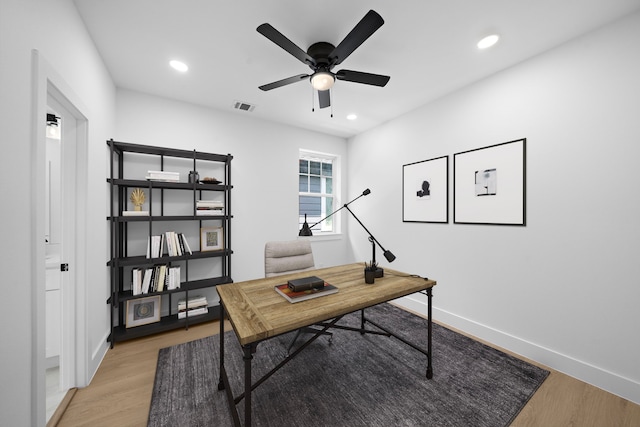 1307 Amundsen St N, Houston, TX 77009 - home office with ceiling fan, light wood-style flooring, and recessed lighting