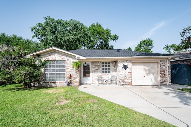 322 S Carroll, La Porte, TX 77571 - single story home with a garage, concrete driveway, a front yard, and brick siding