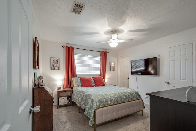 322 S Carroll, La Porte, TX 77571 - bedroom with light colored carpet, a textured ceiling, and ceiling fan