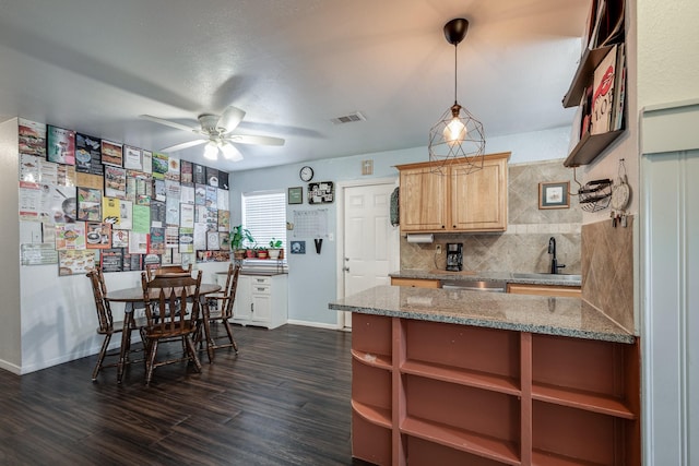 322 S Carroll, La Porte, TX 77571 - kitchen featuring backsplash, ceiling fan, dark wood-style floors, dishwasher, and light stone countertops