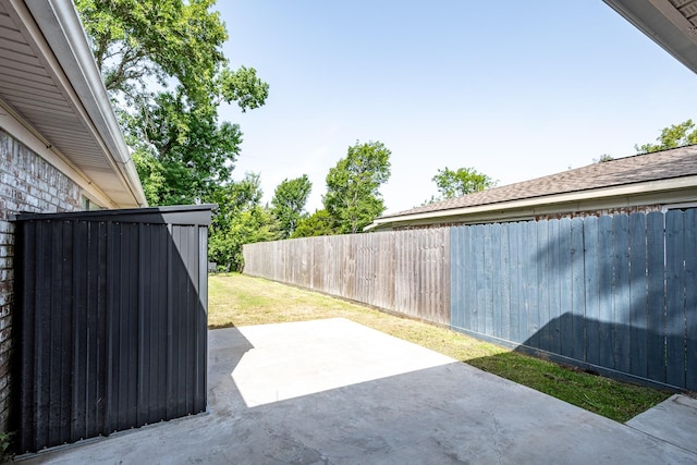 322 S Carroll, La Porte, TX 77571 - fenced backyard with a patio area