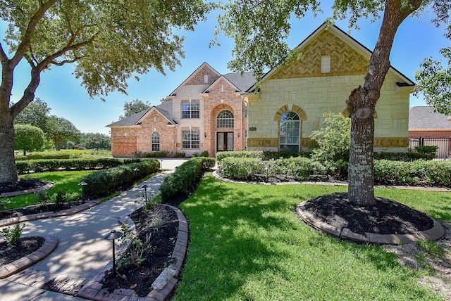 7010 Mcclellan Ln, Sugar Land, TX 77479 - view of front of home with stone siding