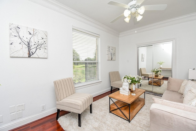 7010 Mcclellan Ln, Sugar Land, TX 77479 - living room with ornamental molding, wood finished floors, and ceiling fan