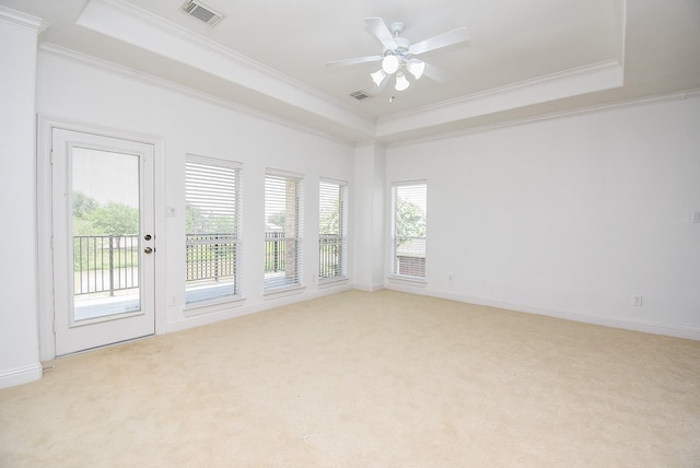 7010 Mcclellan Ln, Sugar Land, TX 77479 - empty room with a raised ceiling, crown molding, light colored carpet, and a ceiling fan