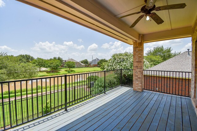 7010 Mcclellan Ln, Sugar Land, TX 77479 - wooden terrace featuring ceiling fan, a lawn, and a residential view