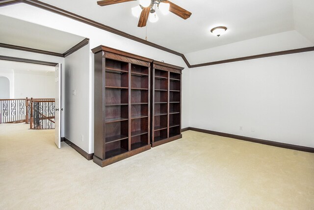7010 Mcclellan Ln, Sugar Land, TX 77479 - carpeted spare room featuring a ceiling fan, ornamental molding, and vaulted ceiling