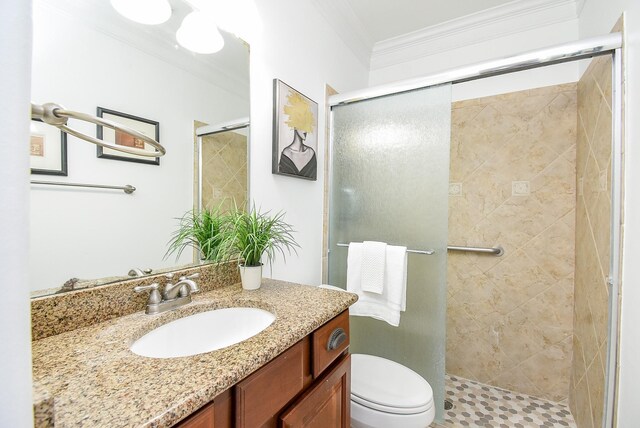 7010 Mcclellan Ln, Sugar Land, TX 77479 - bathroom featuring vanity, a stall shower, and ornamental molding