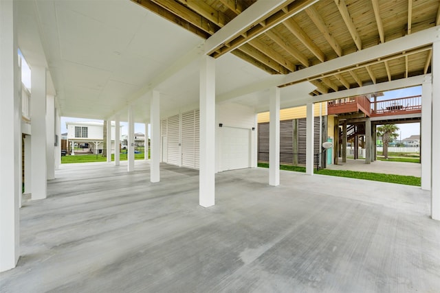 23107 Miramar Cir, Galveston, TX 77554 - view of patio / terrace with stairway and a garage