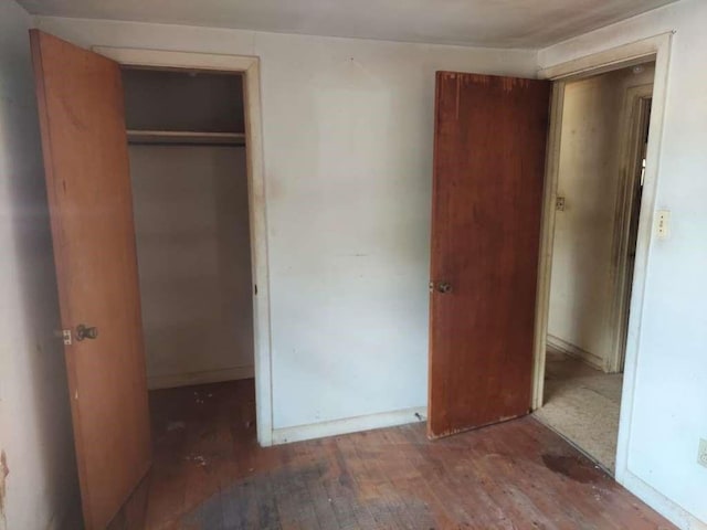343 NW Martin Luther King Dr, De Kalb, TX 75559 - unfurnished bedroom with hardwood / wood-style floors and a closet