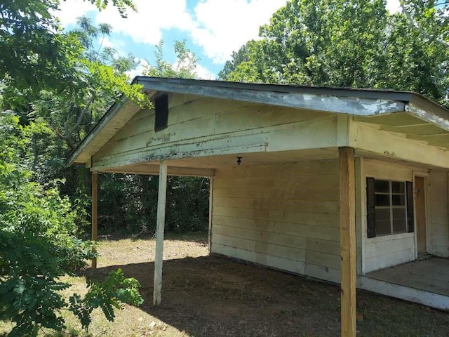 343 NW Martin Luther King Dr, De Kalb, TX 75559 - exterior space featuring a carport