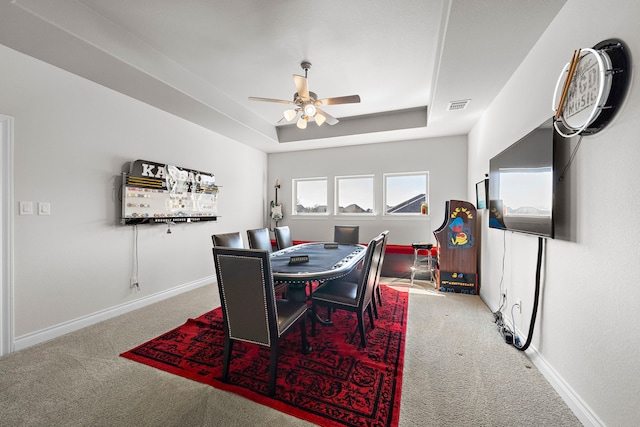2802 Merlin Way, Katy, TX 77493 - carpeted dining area with ceiling fan and a tray ceiling