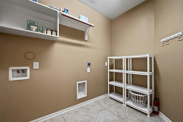 12610 Hobbs Terrace Dr, Tomball, TX 77377 - laundry room with electric dryer hookup, hookup for a washing machine, and tile patterned floors