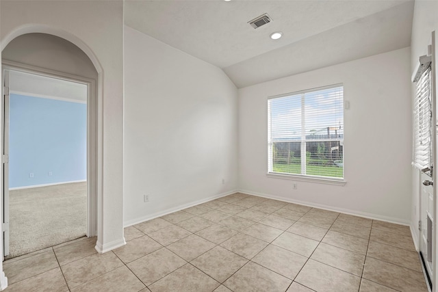 12610 Hobbs Terrace Dr, Tomball, TX 77377 - empty room with light tile patterned floors, lofted ceiling, and recessed lighting