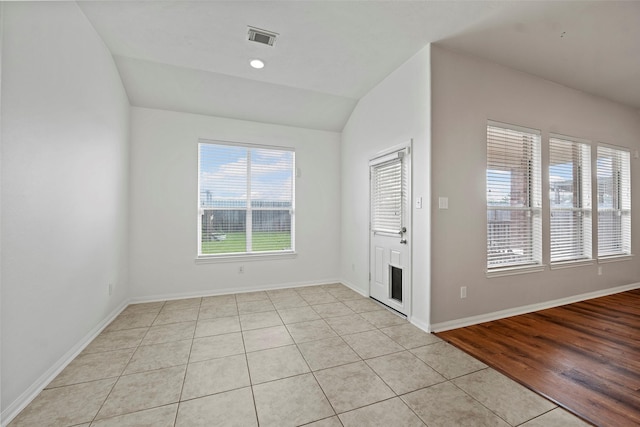 12610 Hobbs Terrace Dr, Tomball, TX 77377 - empty room featuring light tile patterned flooring and lofted ceiling