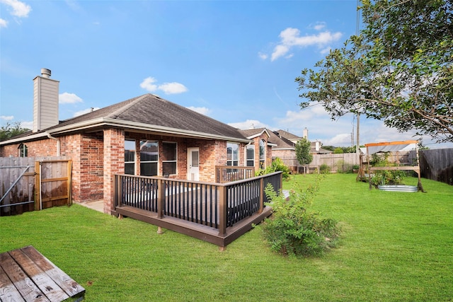 12610 Hobbs Terrace Dr, Tomball, TX 77377 - back of property featuring brick siding, a deck, a fenced backyard, a chimney, and roof with shingles