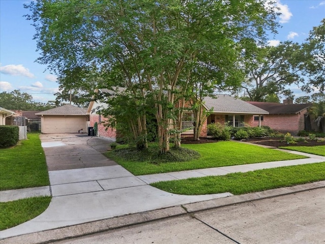 431 Shadow Creek Dr, El Lago, TX 77586 - view of front of home with a front yard, brick siding, and a garage