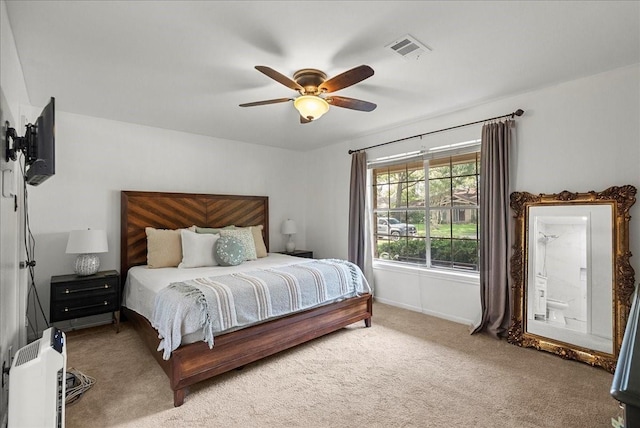 431 Shadow Creek Dr, El Lago, TX 77586 - bedroom with carpet, a ceiling fan, and ensuite bath