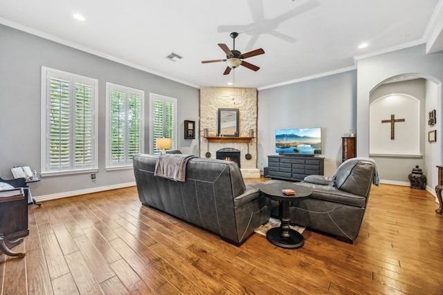 1114 Commons Waterway Dr, Huffman, TX 77336 - living area with ceiling fan, hardwood / wood-style floors, a stone fireplace, crown molding, and recessed lighting