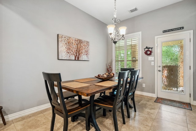 1114 Commons Waterway Dr, Huffman, TX 77336 - dining room featuring a chandelier and light tile patterned floors