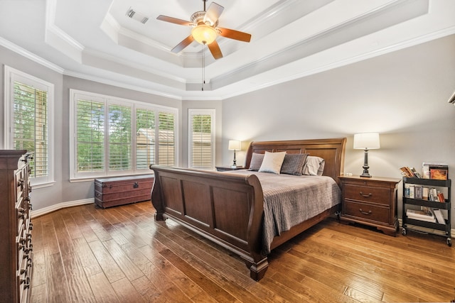 1114 Commons Waterway Dr, Huffman, TX 77336 - bedroom with a raised ceiling, ornamental molding, hardwood / wood-style floors, and a ceiling fan