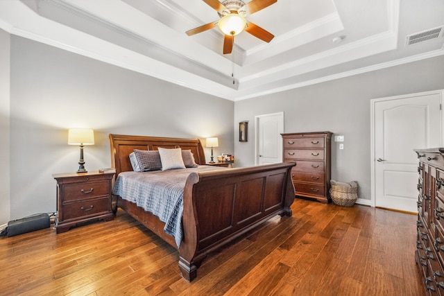 1114 Commons Waterway Dr, Huffman, TX 77336 - bedroom with a tray ceiling, hardwood / wood-style flooring, crown molding, and ceiling fan