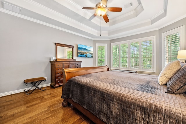 1114 Commons Waterway Dr, Huffman, TX 77336 - bedroom with hardwood / wood-style floors, ornamental molding, a tray ceiling, and a ceiling fan