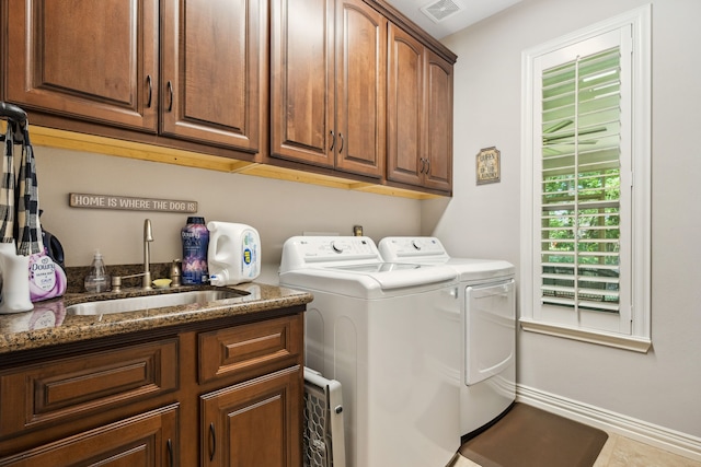 1114 Commons Waterway Dr, Huffman, TX 77336 - laundry area with washing machine and clothes dryer and cabinet space