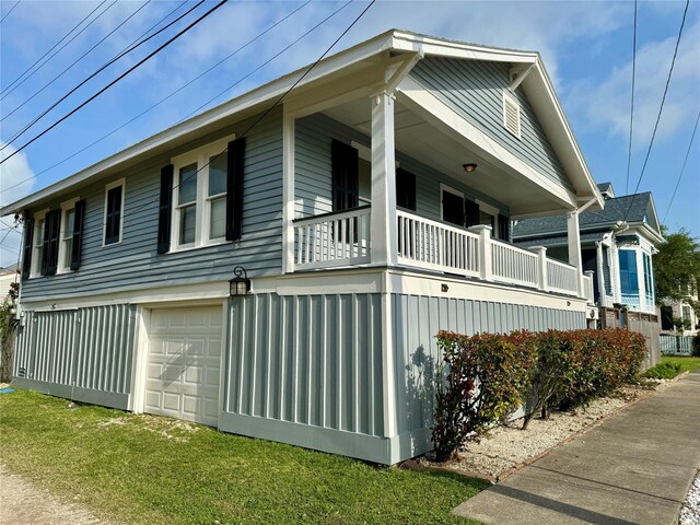 711 17th St, Galveston, TX 77550 - view of property exterior featuring a balcony and a yard