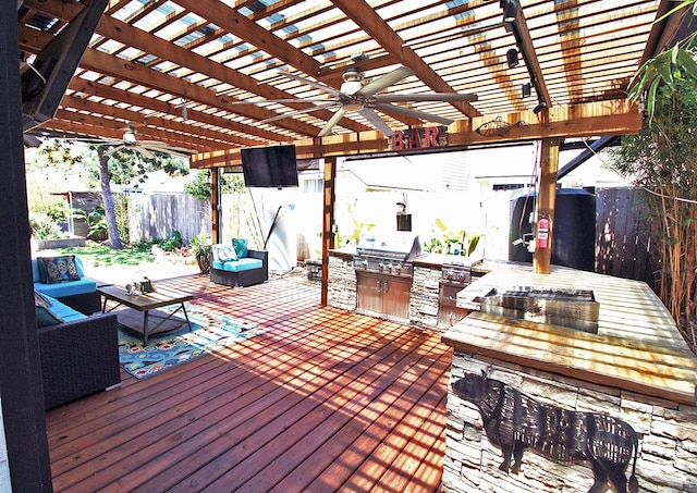 9430 Oratorio Ct, Houston, TX 77040 - wooden deck featuring a fenced backyard, an outdoor kitchen, outdoor lounge area, and ceiling fan