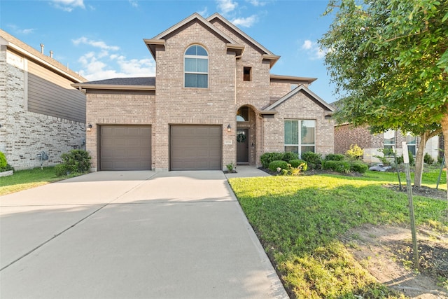 18534 Tall Woods Pl, Houston, TX 77084 - traditional home with brick siding, driveway, a front lawn, and a garage