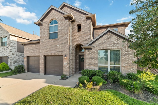 18534 Tall Woods Pl, Houston, TX 77084 - traditional-style house featuring driveway, brick siding, and a garage