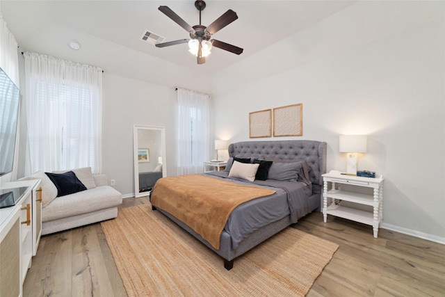 18534 Tall Woods Pl, Houston, TX 77084 - bedroom with light wood finished floors and a ceiling fan
