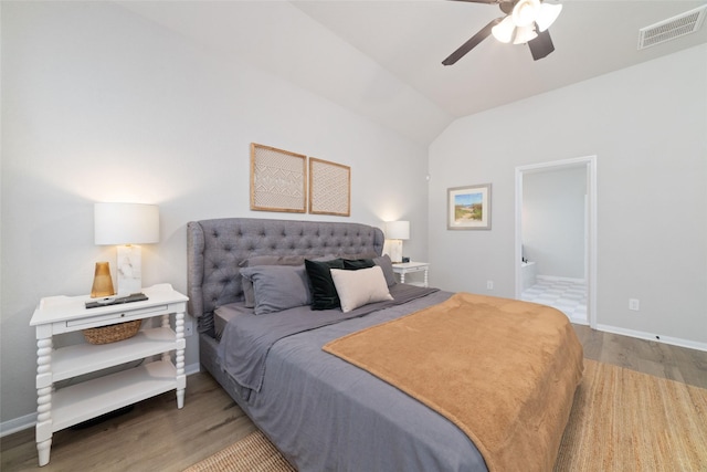 18534 Tall Woods Pl, Houston, TX 77084 - bedroom featuring wood finished floors, vaulted ceiling, connected bathroom, and ceiling fan
