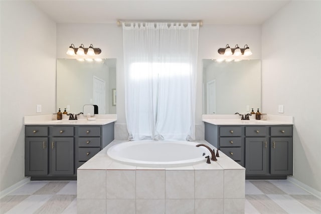 18534 Tall Woods Pl, Houston, TX 77084 - full bathroom featuring two vanities and a garden tub