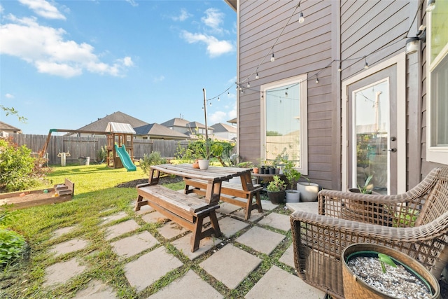18534 Tall Woods Pl, Houston, TX 77084 - fenced backyard featuring a playground and a patio