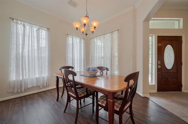 15902 Mill Canyon Ct, Cypress, TX 77429 - dining space with a chandelier, plenty of natural light, crown molding, and dark wood-type flooring